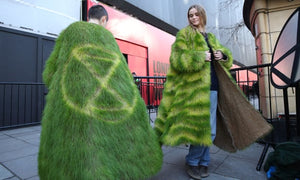Extinction Rebellion Protesters Outside London Fashion Week Wearing Coats Made Of Grass